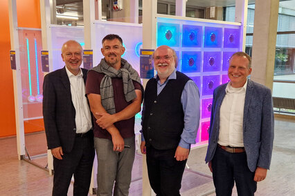 Vorträge zu Grundlagen und Trends von KI - v.l.n.r.: Prof. Dr. Harald Riegel, Prof. Dr. Tim Dahmen, Prof. Dr. Philipp Slusallek, Prof. Dr. Heinz-Peter Bürkle